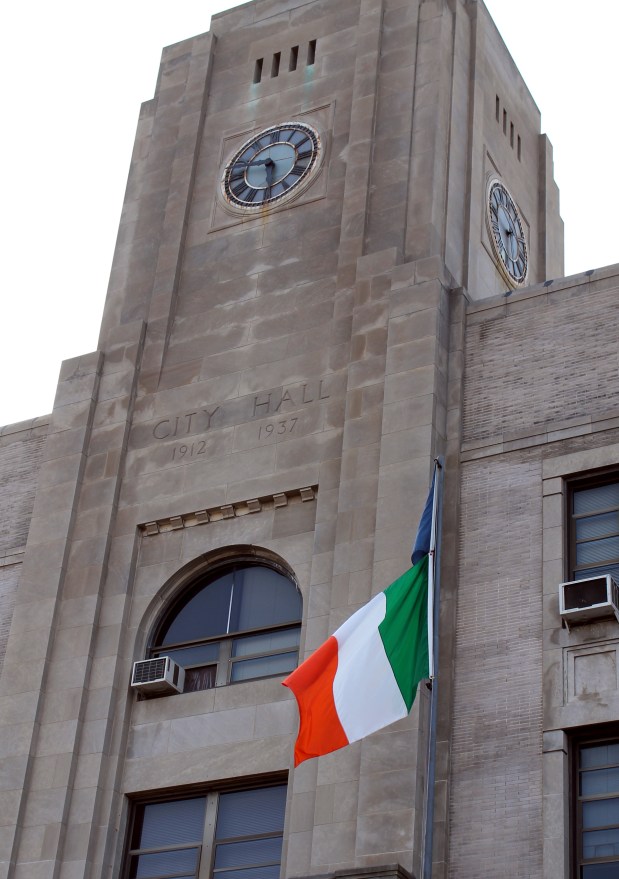 JAMIE PESOTINE/Staff Photographer An Irish flag is flown outside of...