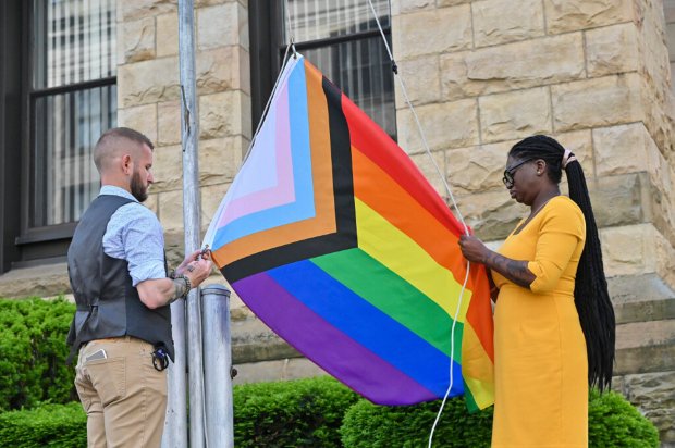 TIMES-TRIBUNE FILE Christopher Smith and Amber Viola connect a flag...