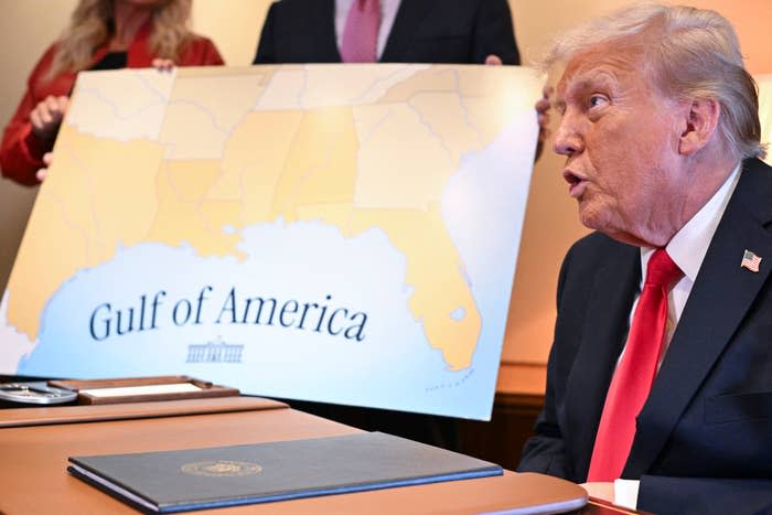 Person at a table with a map titled 