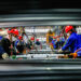 Workers work on the production line at the production workshop of Qingdao Wushun Auto Mold Parts Co. LTD. in China.