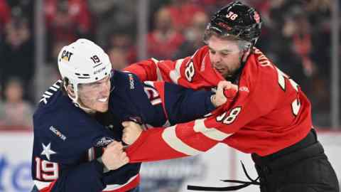 Matthew Tkachuk of Team USA fights with Brandon Hagel of Team Canada during the first period in the 4 Nations Face-Off game