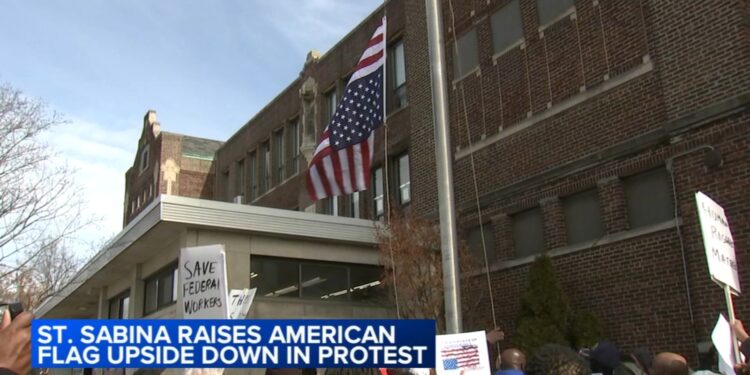 Father Michael Pfleger flies American flag upside-down outside Saint Sabina Church in Gresham, Chicago