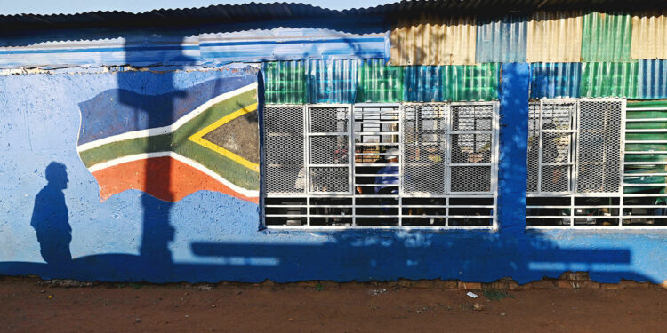 Residents attends a meeting at a community hall on the outskirts of Johannesburg, South Africa