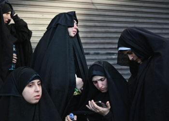 Members of the Lev Tahor Jewish community attend a protest outside the Alida Espana de Arana special education school