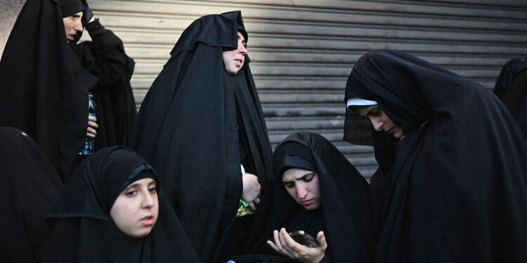 Members of the Lev Tahor Jewish community attend a protest outside the Alida Espana de Arana special education school