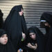 Members of the Lev Tahor Jewish community attend a protest outside the Alida Espana de Arana special education school