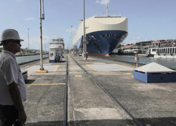 A canal worker stands at the control center of the Miraflores locks on the Panama Canal