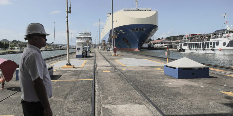 A canal worker stands at the control center of the Miraflores locks on the Panama Canal