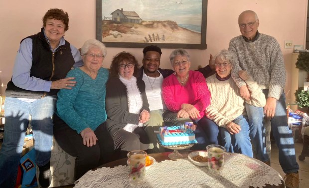 Leominster resident Phyllis Maston invited some friends to a surprise birthday party for her 'adopted' son from Haiti, Dieusson Louis, a memorable experience for all of them. (COURTESY PHYLLIS MASTON)