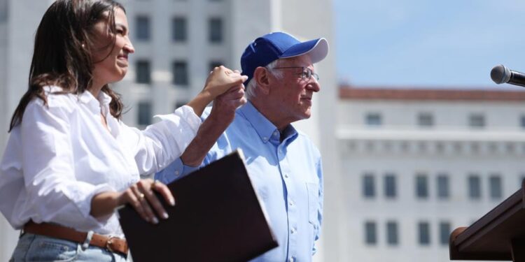 Sanders and AOC tell packed arena Trump is ‘screwing over’ working class – The Guardian