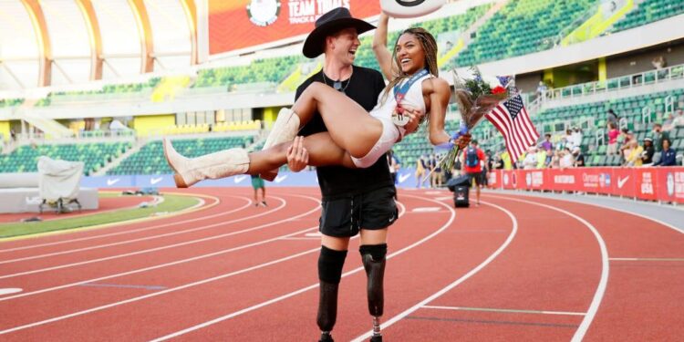 Woodhall Shatters Records with Stunning 100m and 400m Title Sweep!