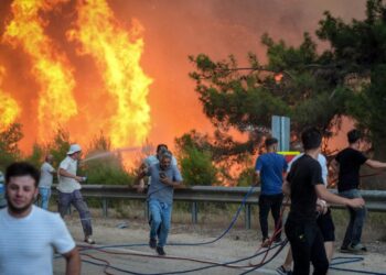 Unstoppable Flames: Brave Crews Battle Wildfires Across North America