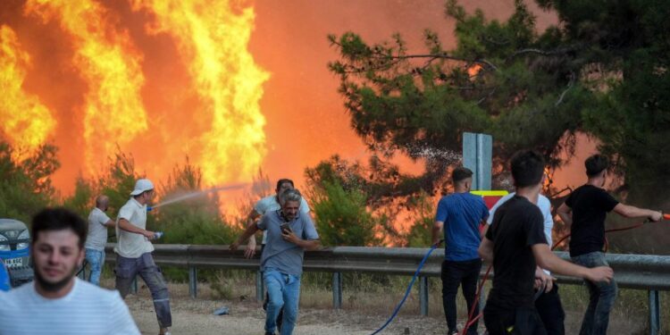 Unstoppable Flames: Brave Crews Battle Wildfires Across North America