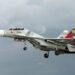 High-Stakes Standoff: Venezuelan Military Aircraft Confronts US Navy Vessel