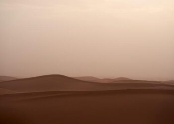 Peru’s Skies Set Ablaze: A Stunning Sandstorm Unleashes Fiery Orange Hues!