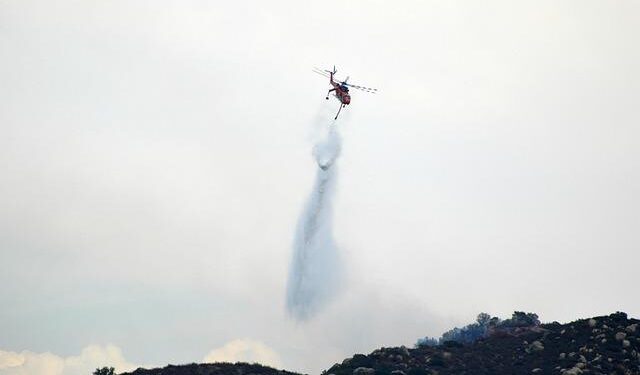 Thrilling Footage: California Wildfires Rage Close to Passing Cars!